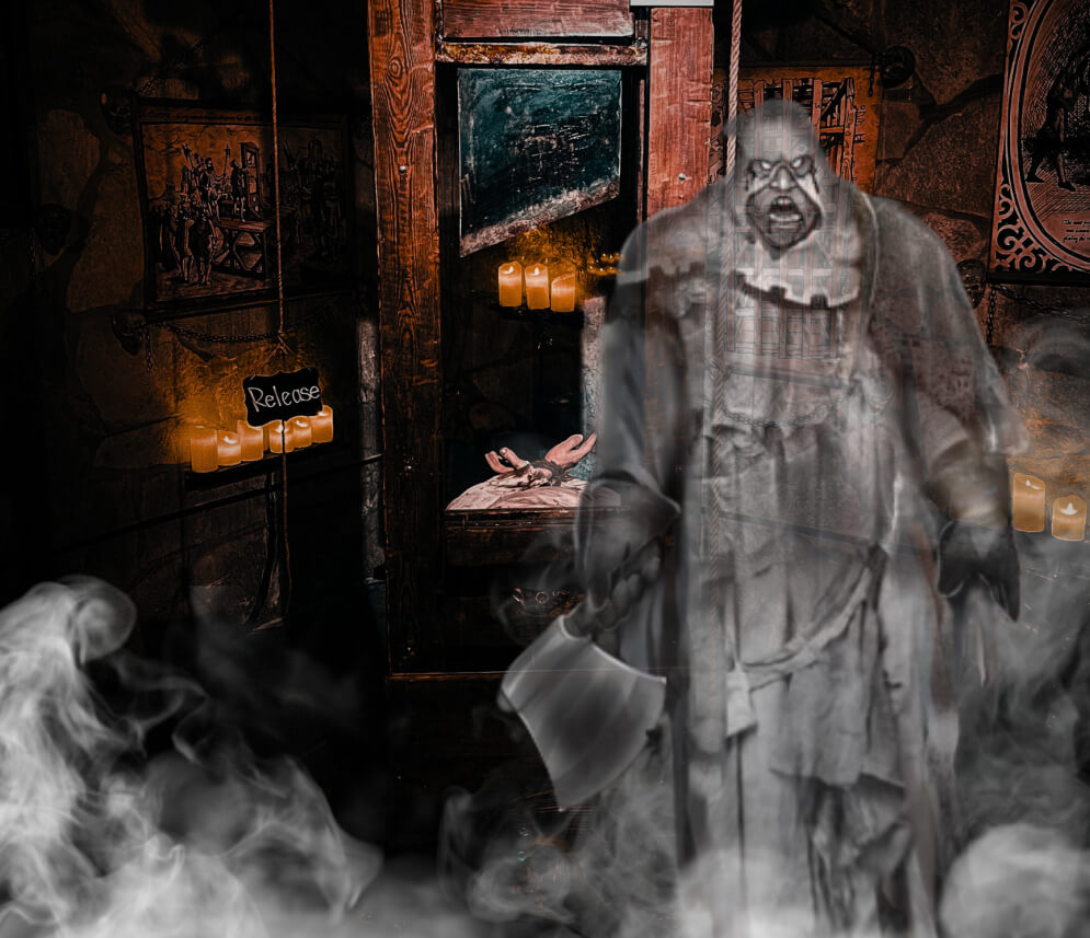 a haunting scene likely from a horror or medieval-themed setting. In the foreground, there is a ghostly figure of an executioner holding an axe, appearing transparent and surrounded by mist or smoke, adding to the eerie atmosphere